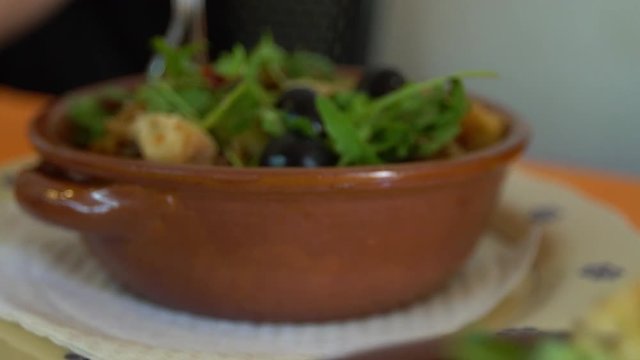 Slow Motion of Cialledda in a restaurant. Salad mixing stale bread with chopped up tomatoes from the Puglia and Basilicata in south of Italy. Culinary Italian cookery with different ingredients. -Dan