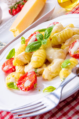 delicious gnocchi with gorgonzola cream sauce and cherry tomatoes