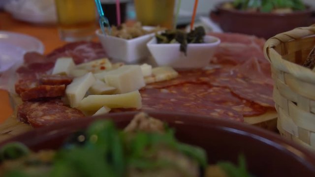 Slow Motion of Cialledda in a restaurant. Salad mixing stale bread with chopped up tomatoes from the Puglia and Basilicata in south of Italy. Culinary Italian cookery with different ingredients. -Dan