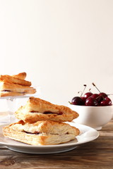 Puff pastry triangles with cherries