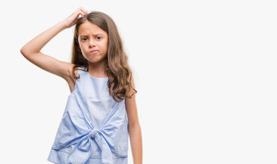 Brunette hispanic girl confuse and wonder about question. Uncertain with doubt, thinking with hand on head. Pensive concept. © Krakenimages.com