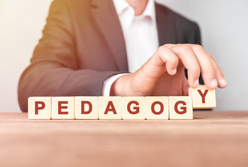 Man made word PEDAGOGY with wood blocks