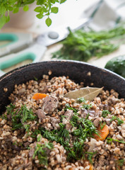 Traditional Russian dish made with buckwheat and liver in a frying pan