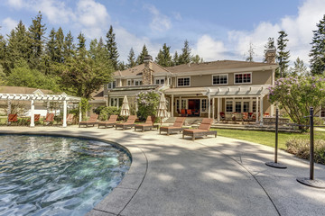 Beautifully landscaped backyard with a large pool.