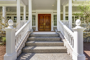 Entrance to a luxury country home with wrap-around deck.
