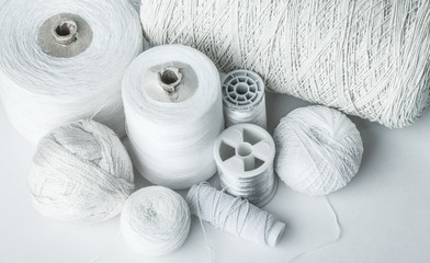 different types of white threads cotton, elastic band, flax, plait, mouline thread, silk