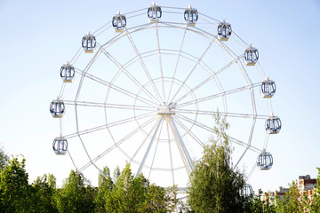 Ferris wheel on blue background
