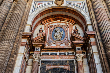 Architectural fragments of Malaga Cathedral façade. Renaissance Cathedral - Roman Catholic Church in the city of Malaga, was constructed between 1528 and 1782. Malaga, Costa del Sol, Andalusia, Spain.