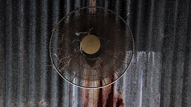 A old fan soeed rotate on metal roof.