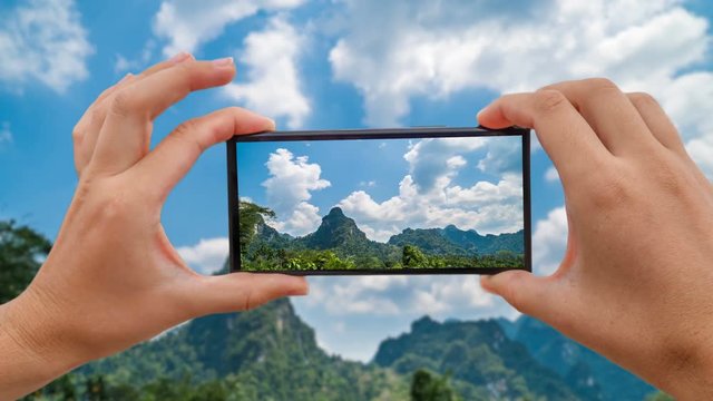 Cinemagraph of Taking Mobile Photo of Limestone Mountain in Khao Sok, Thailand