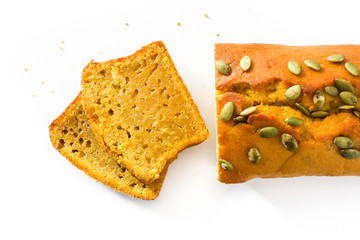Homemade pumpkin bread isolated on white background. Top view