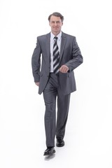 in all growth.a successful businessman, confidently striding forward.