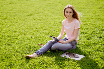 Girl in the Park with a tablet