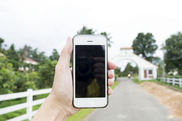 Young man is using the phone to surf the internet. And can play around the world. Internet Key