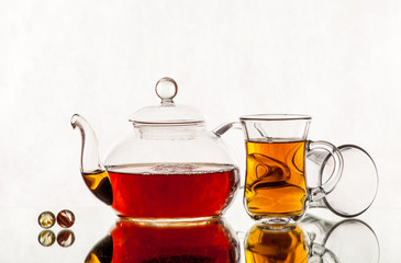 tea pot with tea and cup