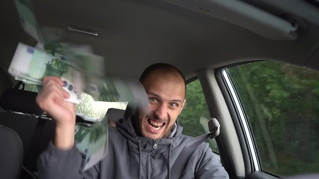 Happy driver with big money euro. Success. Concept on the business success, topic of lottery, winnings, slot machines.