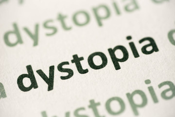 word dystopia printed on paper macro