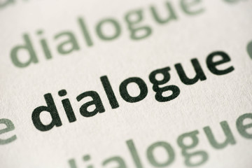 word dialogue printed on paper macro