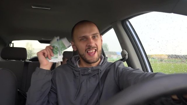 Happy driver with big money euro. Success. Concept on the business success, topic of lottery, winnings, slot machines.