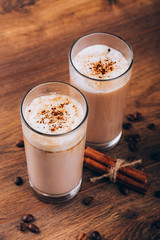 glass of milk and cookie on wooden background