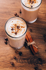 glass of milk and cookie on wooden background