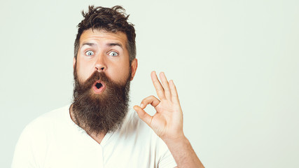 Bearded man smile with hand gesture outdoor. Businessman smiling with beard and and mustache on...
