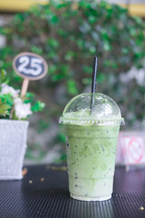 Ice milk green tea in plastic glass