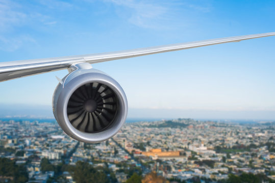 airplane engine above San Francisco city