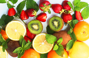 Fototapeta na wymiar citrus fruits and strawberries on a white background