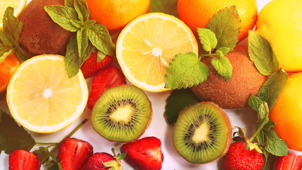 Naklejka na ściany i meble citrus fruits and strawberries on white background