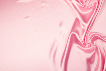 Obraz na płótnie Canvas Pink luxury satin fabric texture for background