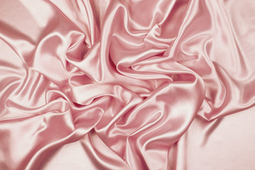 Pink luxury satin fabric texture for background