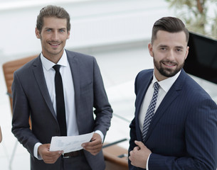 employees standing in a modern office