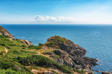 Picture of sea overview with boat on the water and house
