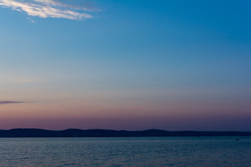 Naklejka na ściany i meble Beautiful sunset above the lake Balaton