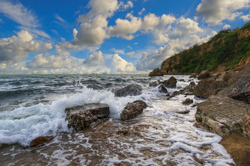 Sea waves and coast. ocean waves splash on rocks and blue sky. Nature landscape