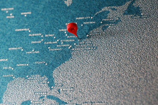 blue painted felt map with the pin