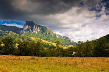 Fototapeta premium trascau mountains with piatra secuiului over the village of Rimetea - famous destination in Transylvania, Romania