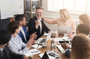 Young team discussing project in modern office