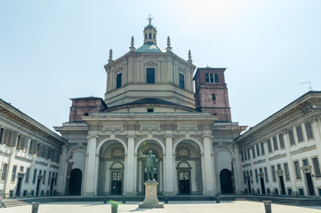 Fototapeta na wymiar Basilica of San Lorenzo Maggiore (Saint Lawrence) at sunny day.