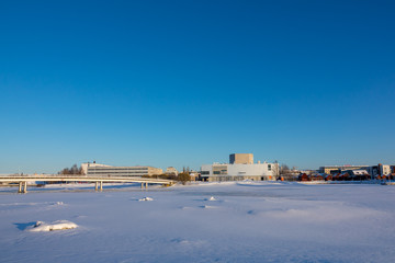 Fototapeta premium View of Oulu in wintertime during sunset