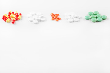 Different tablets. The concept of medicine, disease, health.