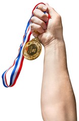Naklejka na ściany i meble Hand Holding a Gold Medal