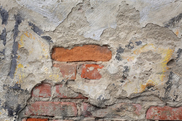 Closeup of weathered old damaged wall, bricks and mortar