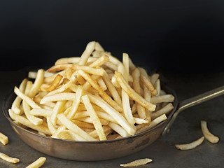 pan of rustic golden french fries