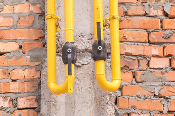 Steel gate valve on the wall of the building for gas.