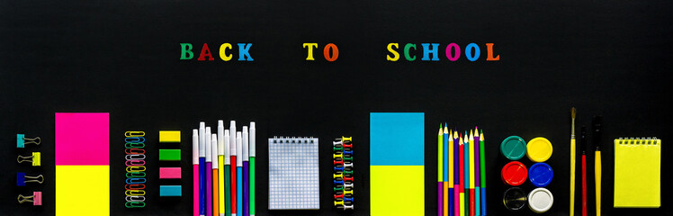 Concept Text Back to school, stationery supplies on black chalkb