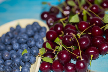 Ripe cherry and blueberry, close-up shot