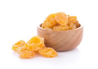 Dry yellow plums on white background. top view