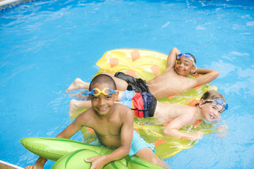 Children in outside swimming pool